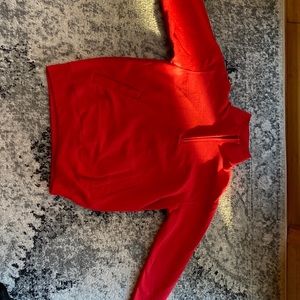 This is a champion red quarter zip sweat shirt.